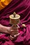 Tibetan prayer wheel in monks hands