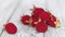 Tibetan raspberry on a rustic white wooden table. Red berries on white. Shallow depth of field.