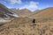 Tibetan shepherd in SiChuan using a slingshot to gather its yaks