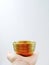 Tibetan singing bowl in hand. Sound therapy. Copy space, vertical photo, selective focus