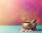 Tibetan singing bowl with healing stones on a colorful background.