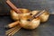 Tibetan singing bowls with palo santo and aroma sticks on the dark background. Music instruments for meditation, relaxation, yoga