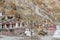 Tibetan traditional stupas and village at the Hemis monastery with background of barren mountains in Leh, Ladakh, Jammu and