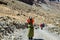 Tibetan woman commits bark around Mount Kailash.