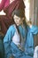 Tibetan woman in traditional dress attends Amitabha Empowerment Buddhist Ceremony, Meditation Mount in Ojai, CA