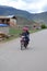 Tibetan women riding a bike