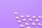 Tic tac sweets on violet background