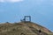 Ticino, Switzerland - August 5, 2019: Tourists visit art suspened Cube by Jaya Schurch on top of Monte Tamaro