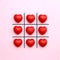 Tick tack toe made from red heart on pink background