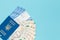 Tickets for airplanes and passport, Ukrainian hryvnia on a blue background. Copy space for text