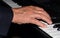 Tickling The Ivories - Closeup of Hand Playing Piano
