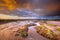 Tidal Channel in Estuary marshland at sunrise