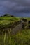 Tidal creek with stormy sky