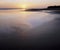 Tidal flats and ocean at sunset