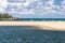 Tidal pool sand ocean and clouds Hawaii