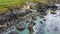 Tidal waves of the Atlantic Ocean near the southern coast of the island of Ireland. Rocky seashore. Seascape, top view. Aerial