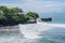 Tidal waves breaking on the coast of Hindu Tanah Lot Temple complex on Bali island, Indonesia
