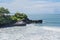 Tidal waves breaking on the coast of Hindu Tanah Lot Temple complex on Bali island, Indonesia