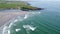 Tidal waves and the picturesque rocky coast of Ireland, drone video. Seaside landscape. Waves of the Atlantic Ocean