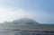 Tide coming onto the beach in front of St Michaels Mount
