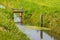 Tide gauge and small weir in a ditch