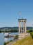 The tide gauge tower of Neuwied, Germany , with ships on the rhine river