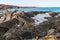 Tide Pools and Ancient Lava Flow on The Shore of Kakapa Bay