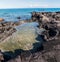 Tide Pools and Ancient Lava Flow on The Shore of Kakapa Bay