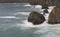 Tide rushes over rocks near the Bedruthian Steps, Cornwall