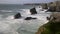 Tide rushes over rocks near the Bedruthian Steps, Cornwall