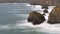 Tide rushes over rocks near the Bedruthian Steps, Cornwall