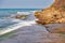 The tide submerging the narrow coastal walkway at Peveril Point Swanage England