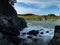 Tide wave on rocky shore.