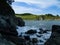 Tide wave on rocky shore.