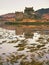 Tides in the lake at Eilean Donan Castle, Scotland. The popular stony bridge