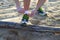 Tie his shoes on the beach