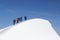 Tied climbers climbing mountain with snow field tied with a rope with ice axes and helmets