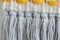 Tied knot of white grey and yellow rope macrame