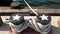 Tied rope knot on metallic bollard with stars, seafaring port of San Diego, California. Nautical ship moored in dock