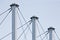 Tied Suspension Roof Cables, Three Tall Grey Masts, Cable-suspended Swooping Rooftop Pylon Anchors, Pale Blue Summer Sky, Large