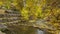 Tiered screened in rocks on a shallow stream bank