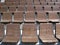 Tiers of wooden chairs in outdoor arena