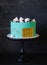 Tiffany color cake wrapped in a biscuit tape with golden bricks