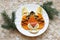 Tiger face made of fruits on white plate, chinese new year