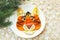 Tiger face made of fruits on white plate, chinese new year, spruce branch