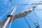 Tigging and masts of an old sailing ship against the blue sky with clouds. Travel adventure and travel concept, copy space