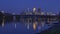 A tight shot on downtown Minneapolis illuminating during twilight over the mighty Mississippi River on a Calm Summer Evening