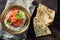 Tikka masala with rice and chicken served with Naan bread