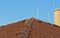 Tile roof with chimney and lightning protection system installed. Lightning rods. Close-up shot. Lightning conductor