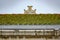 Tile roof covered with grass and blurred cross